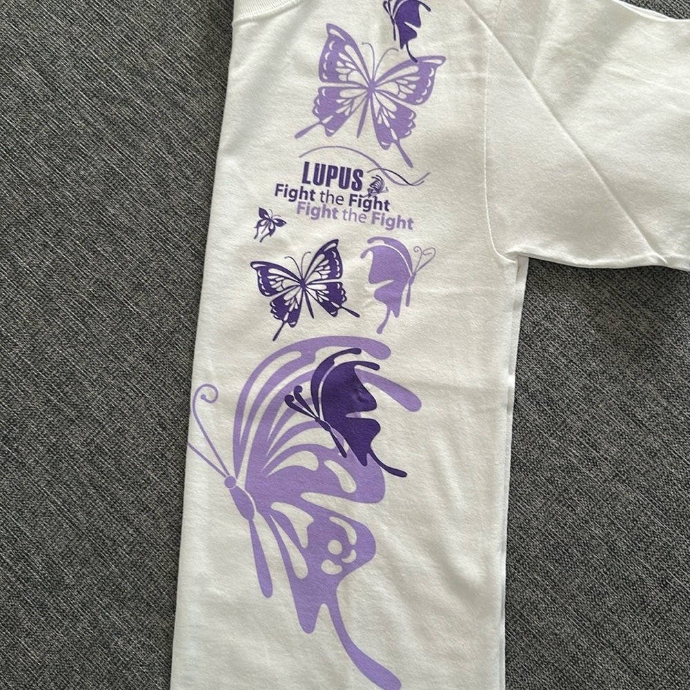 White and Purple Tee with Butterfly print. Lupus fight the fight.